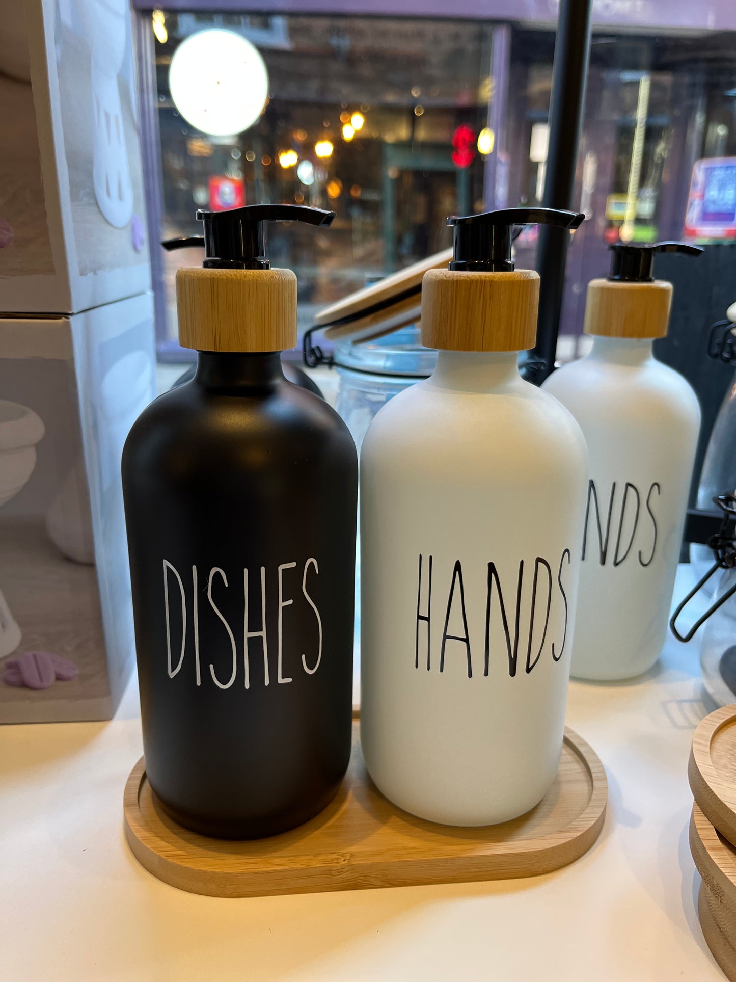 Minimal design glass pump bottles perfect for dispensing hand soap & washing up liquid in opaque black & white glass with a bamboo screw top and black pump. Choose from a black ‘dishes’ or a white ‘hands’ design. Holds 500ml.