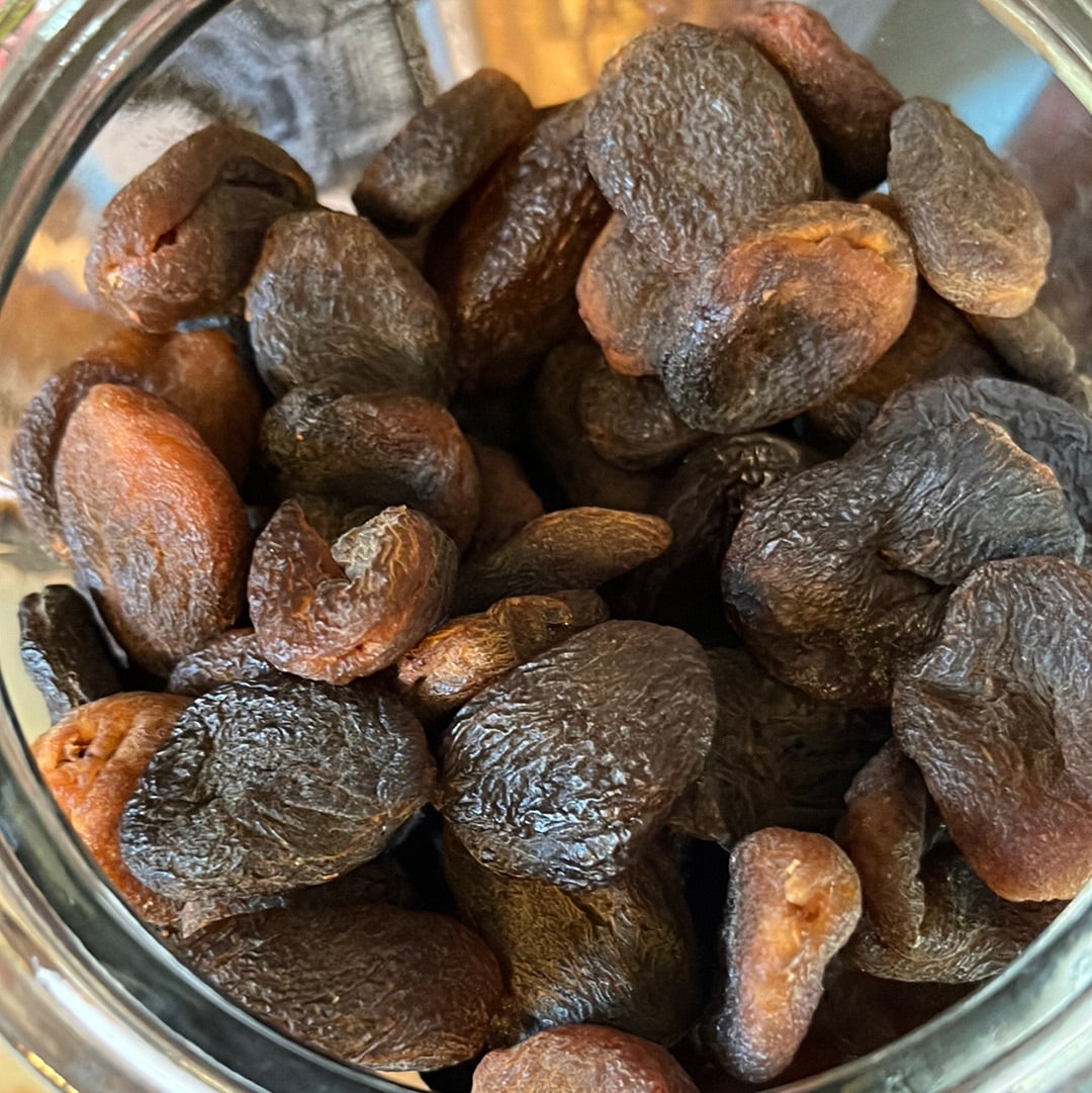 Apricots top down in a jar.